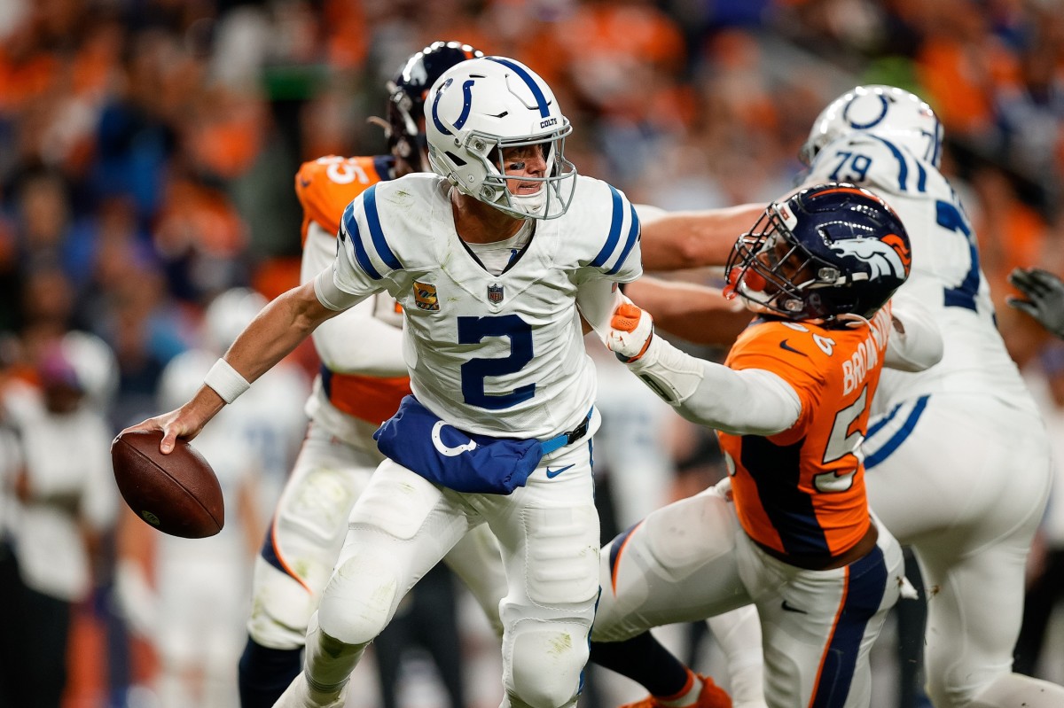 Denver Broncos cornerback Pat Surtain II (2) scrambles under pressure from Denver Broncos linebacker Baron Browning (56) in the second quarter at Empower Field at Mile High.