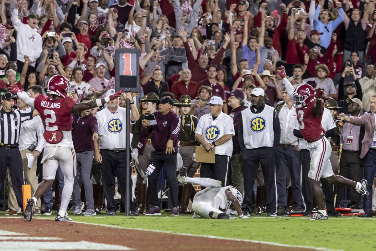 Alabama defensive backs DeMarcco Hellams and Terrion Arnold  signal no catch on the final play against Texas A&M.