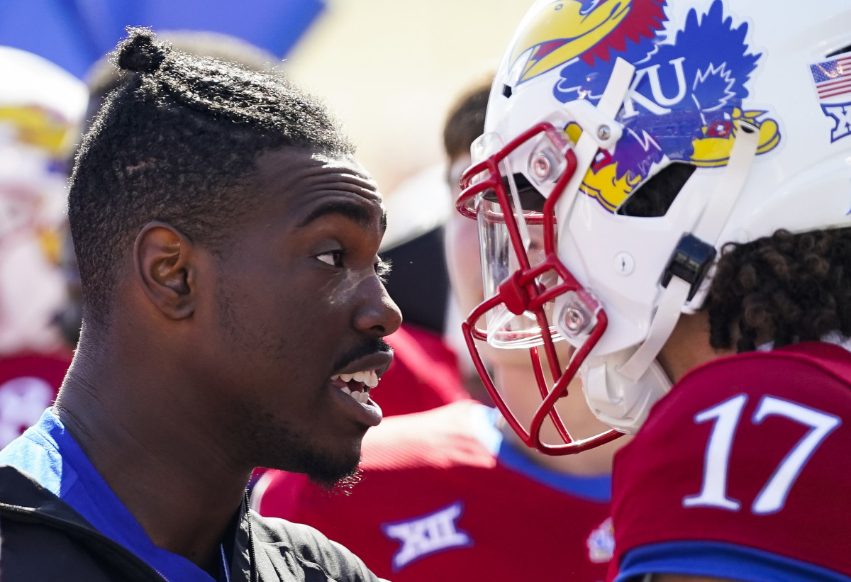 Oct 8, 2022; Lawrence, Kansas, USA; Kansas Jayhawks quarterback Jalon Daniels (6) talks with quarterback Jason Bean (17) after leaving the game with an injury during the second half against the TCU Horned Frogs at David Booth Kansas Memorial Stadium. Mandatory Credit: Jay Biggerstaff-USA TODAY Sports