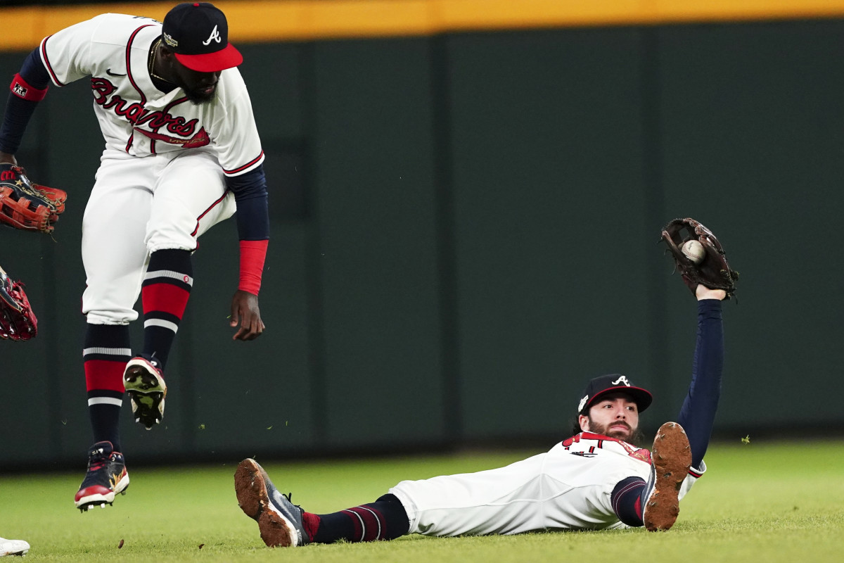 Dansby Swanson shows his glove after making an incredible diving catch.