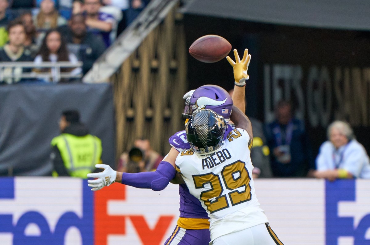 Oct 2, 2022; Vikings receiver Adam Thielen (19) catches a pass under pressure from New Orleans Saints cornerback Paulson Adebo (29). Mandatory Credit: Peter van den Berg-USA TODAY Sports