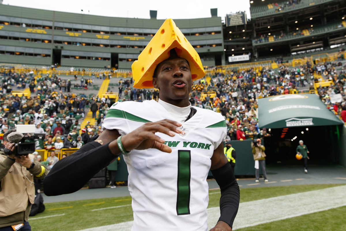 Oct 16, 2022; Green Bay, Wisconsin, USA; New York Jets cornerback Sauce Gardner (1) celebrates defeating the Green Bay Packers by wearing a cheesehead on the field following the game at Lambeau Field. Mandatory Credit: Jeff Hanisch-USA TODAY Sports