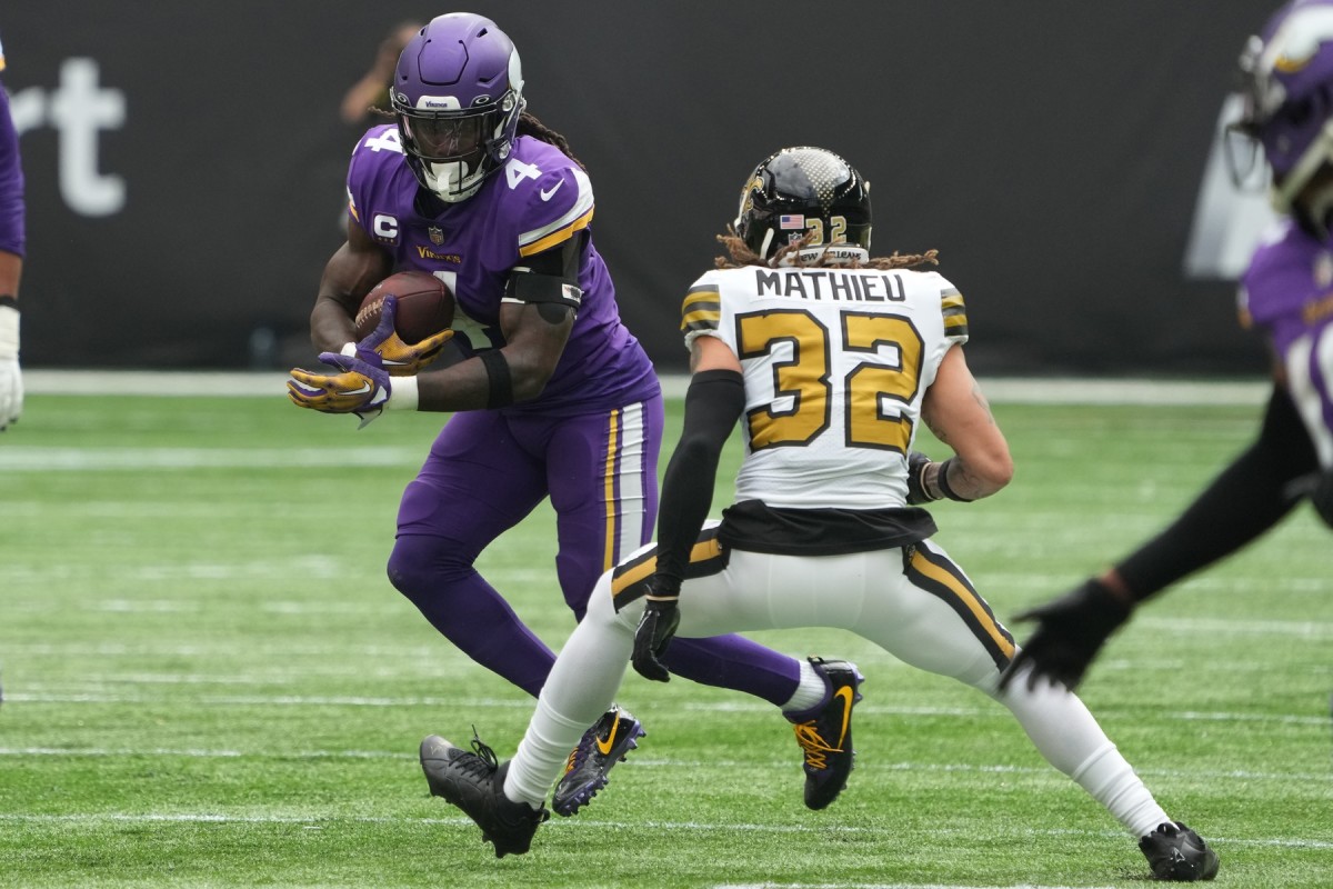 Minnesota Vikings running back Dalvin Cook (4) is defended by New Orleans Saints safety Tyrann Mathieu (32). Mandatory Credit: Kirby Lee-USA TODAY