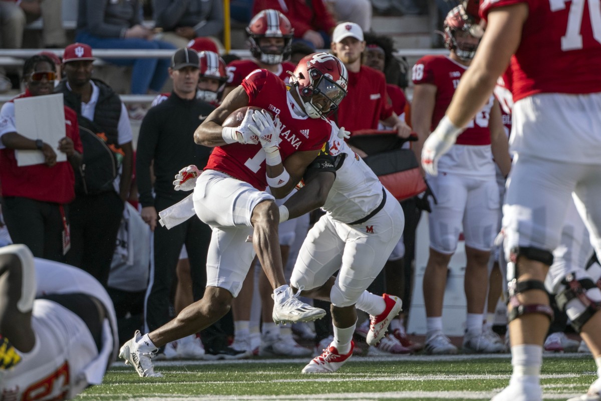 Maryland Terrapins defensive back Caleb Atogho (30) tackles Indiana Hoosiers wide receiver Donaven McCulley (1) during the second quarter at Memorial Stadium.