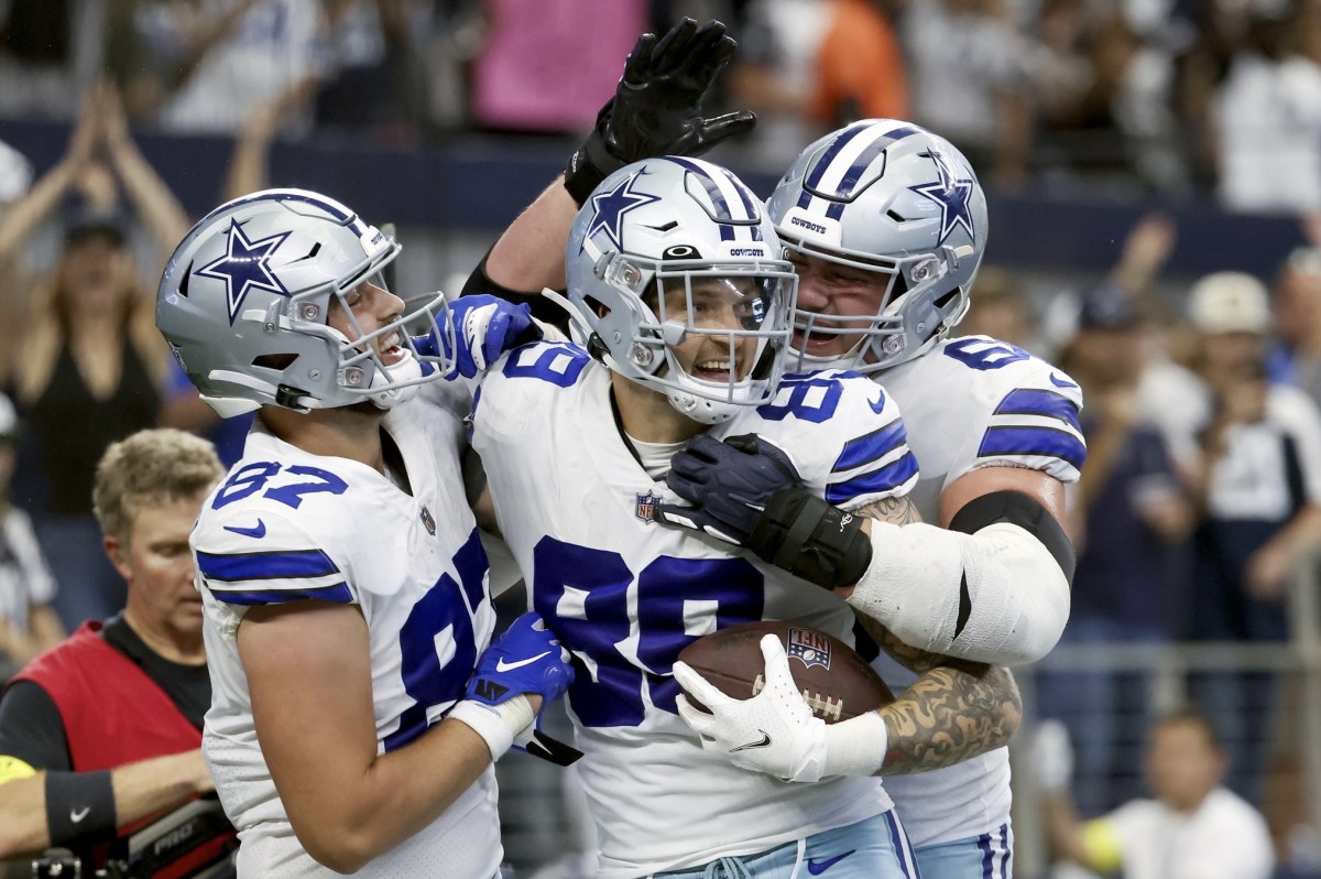 Dallas Cowboys tight end Peyton Hendershot (89) celebrates with teammates after catching a touchdown pass during the fourth quarter against the Detroit Lions at AT&T Stadium.