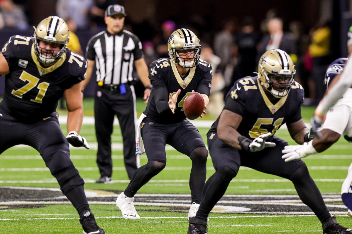 New Orleans Saints quarterback Andy Dalton (14) takes the snap against the Seattle Seahawks. Mandatory Credit: Stephen Lew-USA TODAY Sports