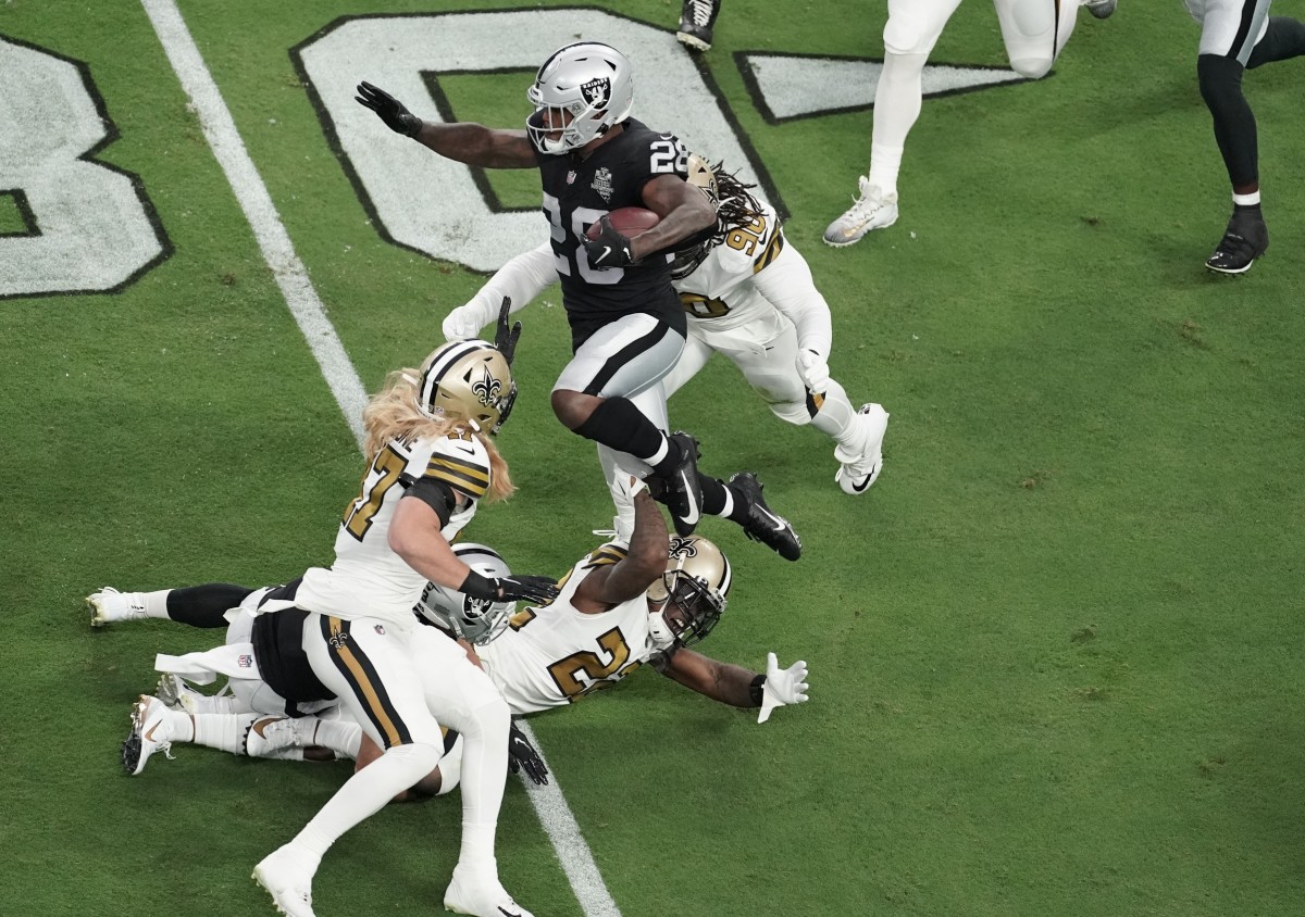 Sep 21, 2020; Las Vegas Raiders running back Josh Jacobs (28) is tackled by the New Orleans Saints defense. Mandatory Credit: Kirby Lee-USA TODAY Sports