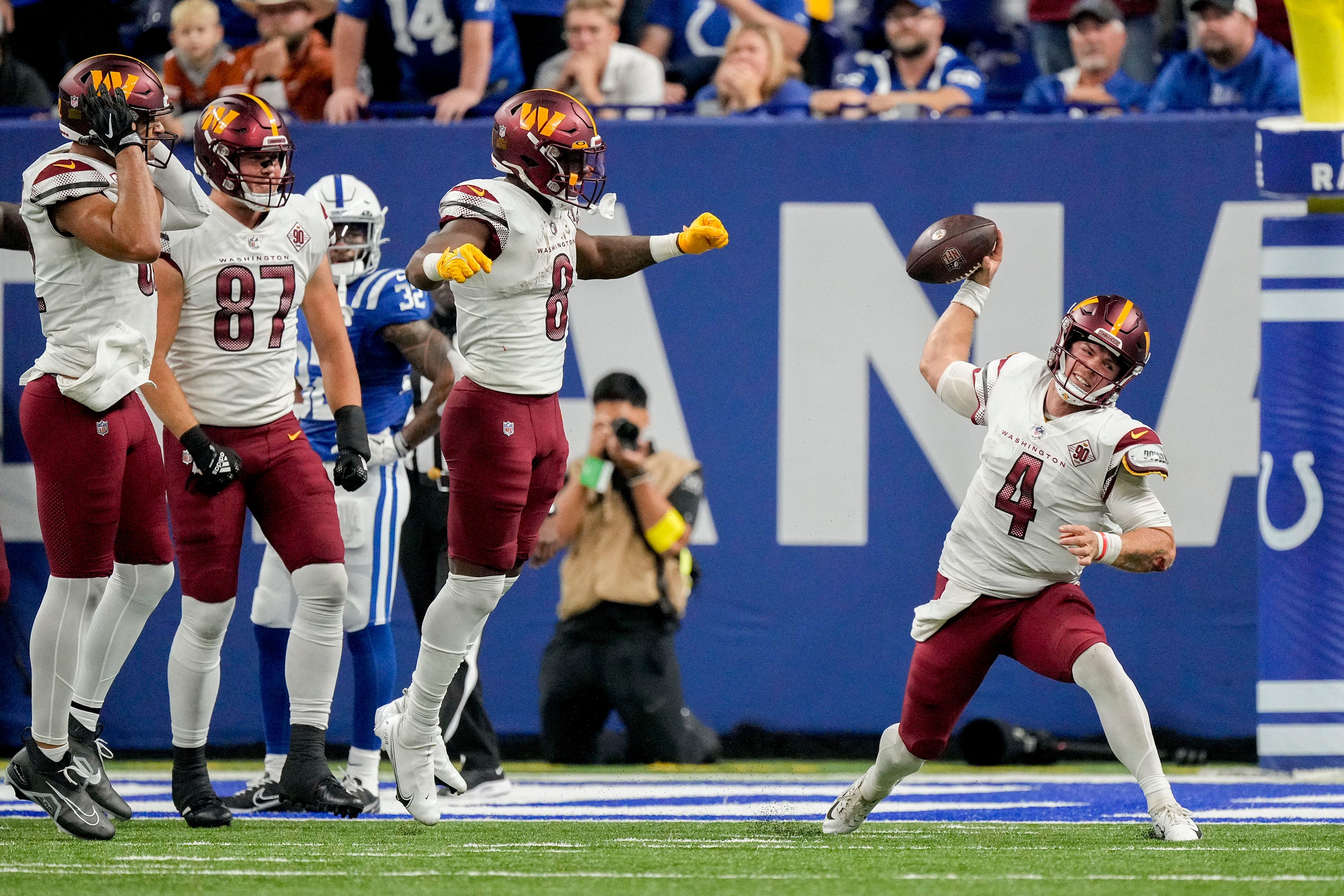 Washington Commanders quarterback Taylor Heinicke (4) spikes the ball after a game-tying touchdown Sunday, Oct. 30, 2022, during a game against the Indianapolis Colts at Indianapolis Colts at Lucas Oil.