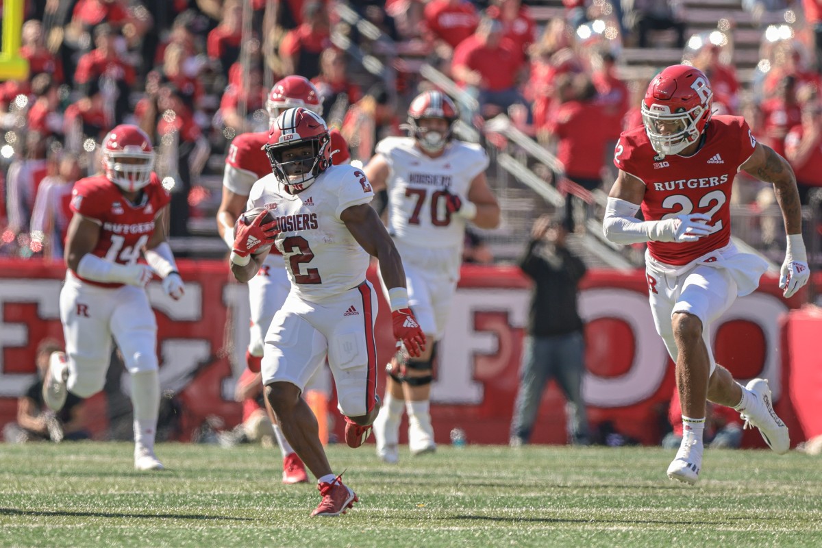 Indiana Hoosiers running back Shaun Shivers (2) carries the ball as Rutgers Scarlet Knights linebacker Tyreem Powell (22) pursues during the first half at SHI Stadium.