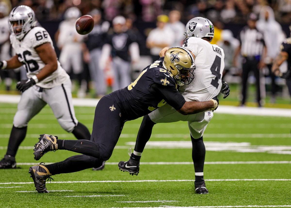 New Orleans Saints defensive end Cameron Jordan (94) hits Las Vegas Raiders quarterback Derek Carr (4) as he throws. Mandatory Credit: Stephen Lew-USA TODAY Sports