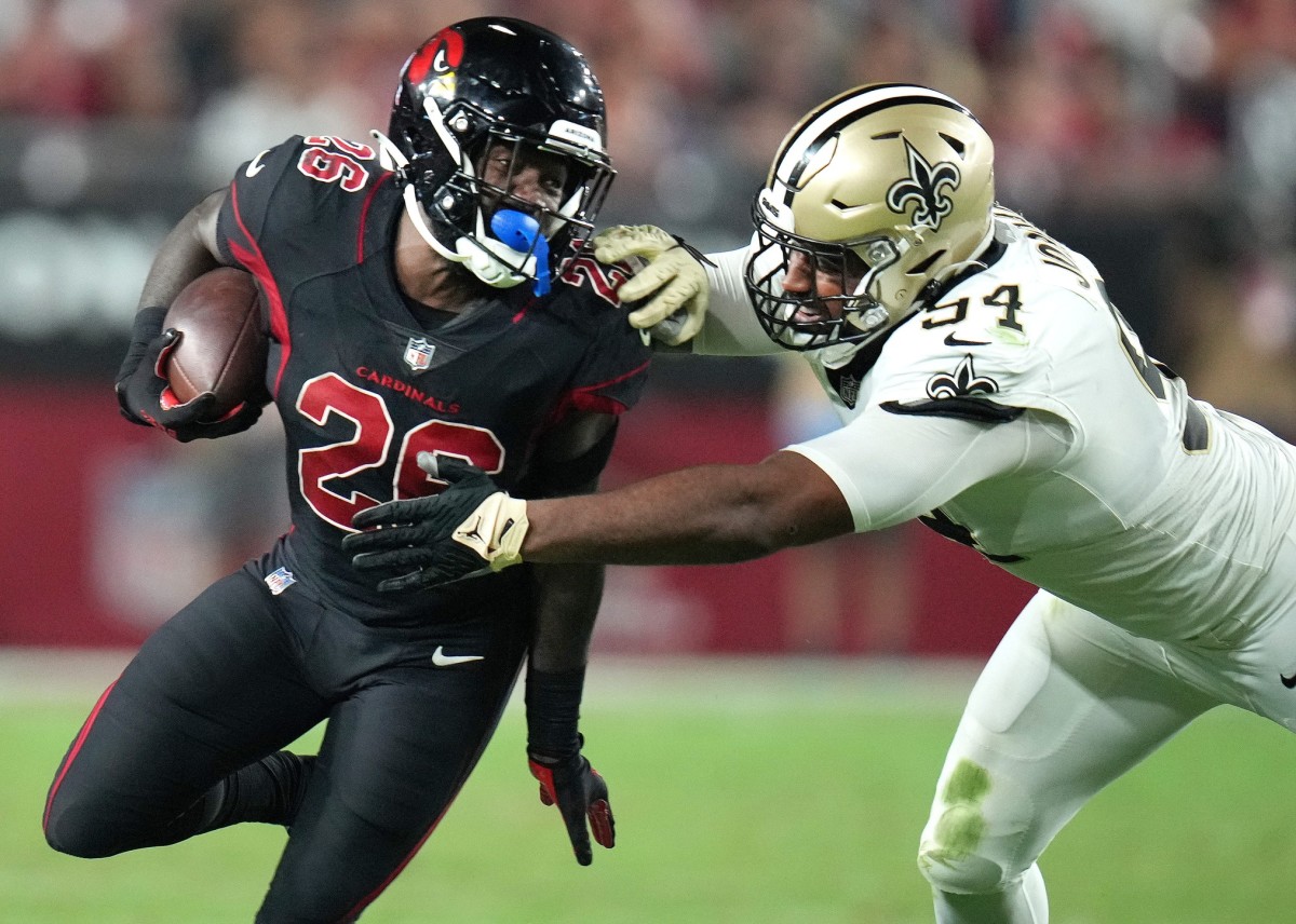 Arizona Cardinals running back Eno Benjamin (26) tries to break past New Orleans Saints defensive end Cameron Jordan (94). Mandatory Credit: Joe Rondone-Arizona Republic