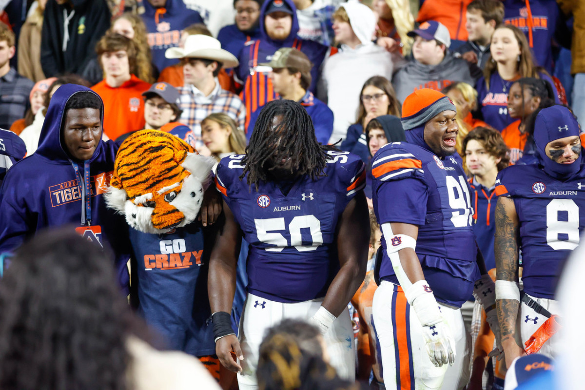 Marcus Harris and Aubie celebrating the Auburn football win vs Texas A&M.