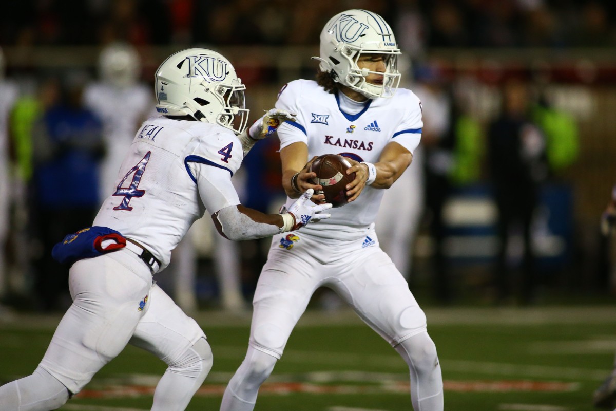 Kansas Jayhawks quarterback Jason Bean, running back Devin Neal, handoff