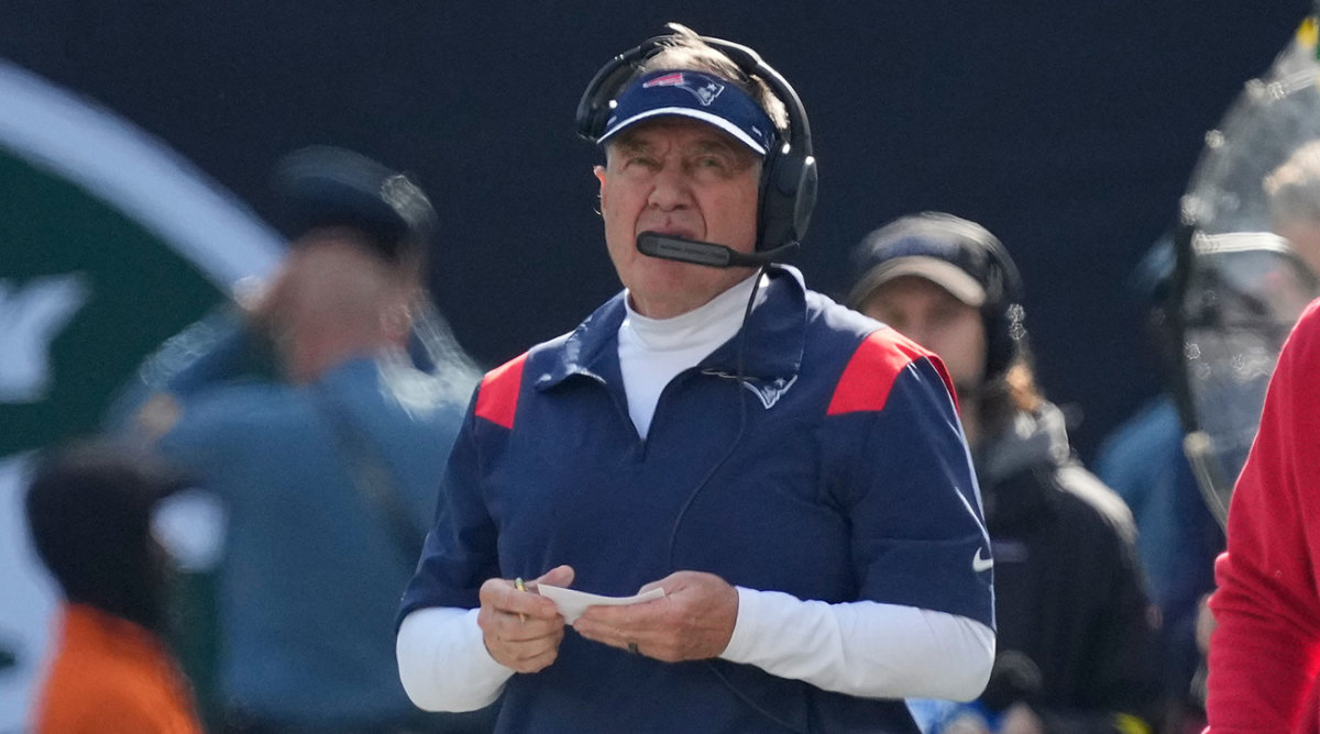 Bill Belichick looks out at the field showing no emotion