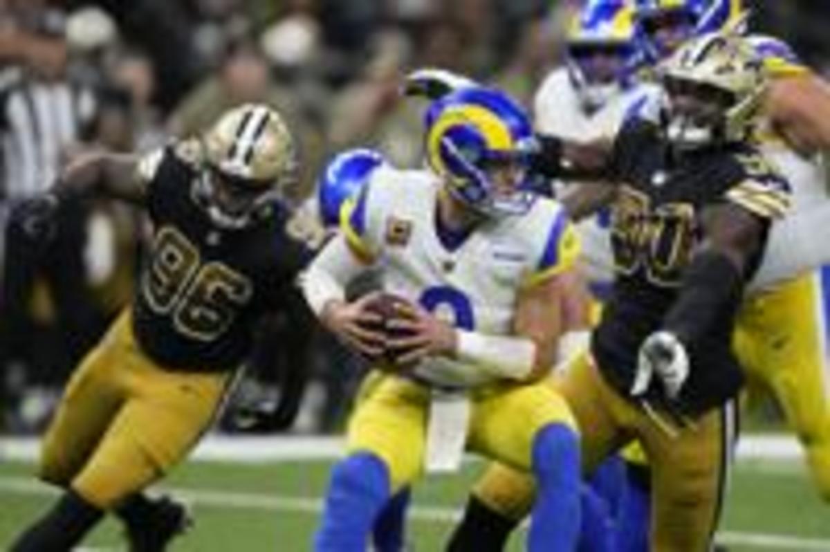 Saints Defensive linemen Tanoh Kpassagnon (90) and Carl Granderson (96) pressure Rams QB Matthew Stafford (9). Credit: Idaho State Journal