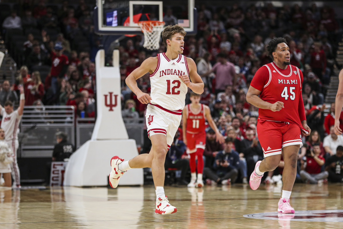 Miller Kopp wags his tongue while running upcourt after hitting a three-pointer on Sunday at Gainbridge Fieldhouse in Indianapolis. (Photo courtesy of IU Athletics)
