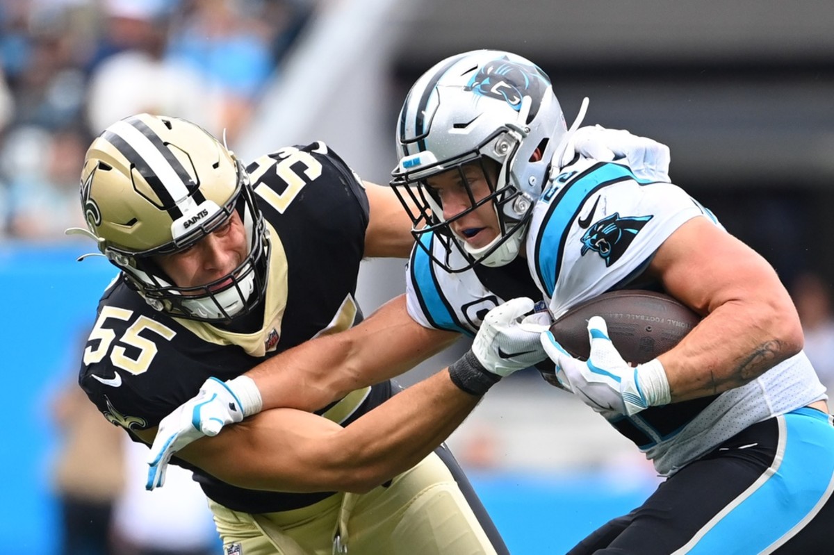 Sep 25, 2022; New Orleans Saints linebacker Kaden Elliss (55) tackles Carolina Panthers running back Christian McCaffrey (22). Mandatory Credit: Bob Donnan-USA TODAY Sports