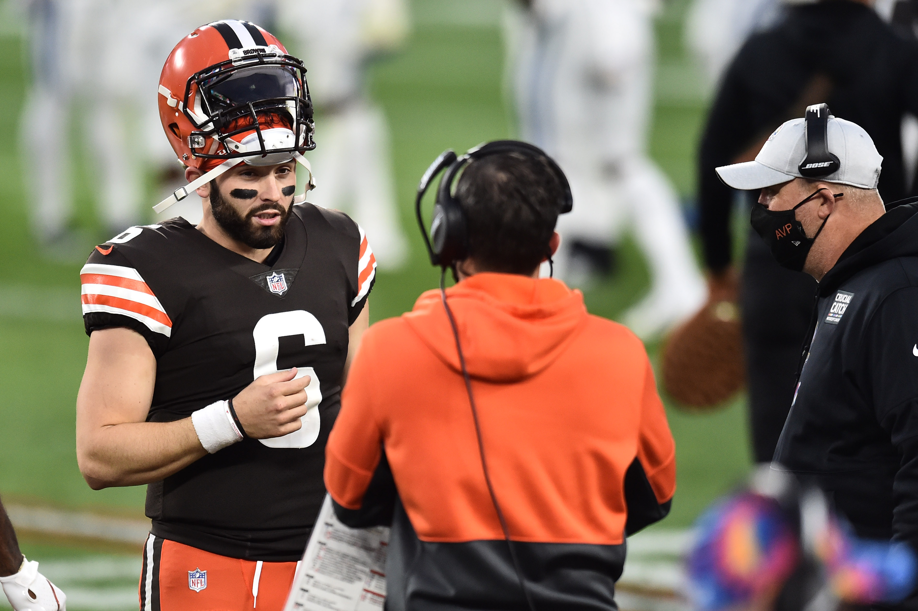 Oct 11, 2020; Cleveland, Ohio, USA; Cleveland Browns quarterback Baker Mayfield (6) talks with head coach Kevin Stefanski and offensive coordinator Alex Van Pelt during the second half against the Indianapolis Colts at FirstEnergy Stadium.