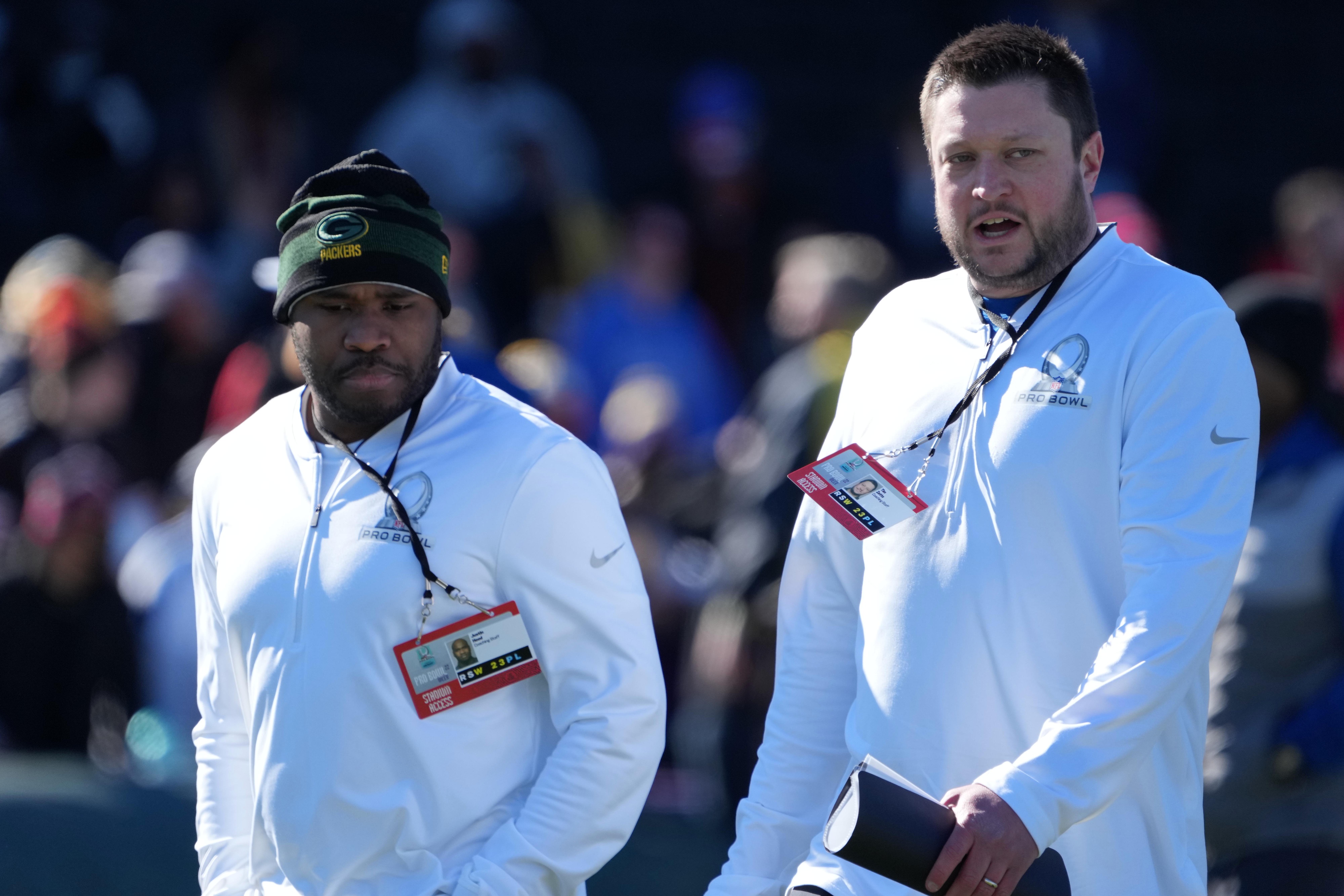 Feb 4, 2022; Las Vegas, NV, USA; Green Bay Packers defensive quality control coach Justin Hood (left) and offensive quality control coach Tim Zetts during NFC practice at the Las Vegas Ballpark.