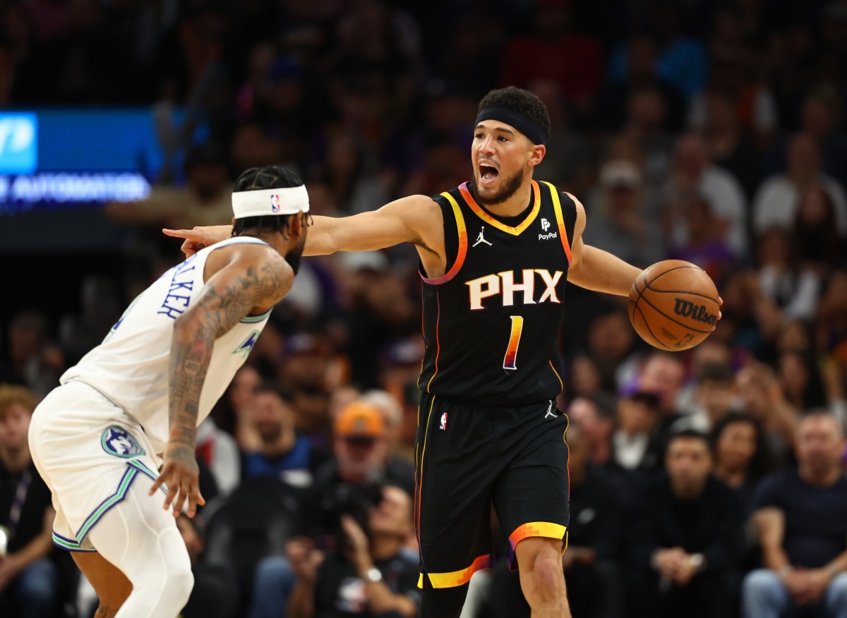 Nov 15, 2023; Phoenix, Arizona, USA; Phoenix Suns guard Devin Booker (1) reacts against the Minnesota Timberwolves in the first half at Footprint Center.
