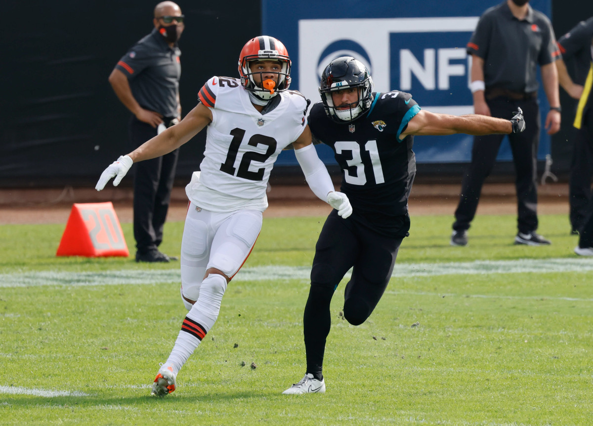Nov 29, 2020; Jacksonville, Florida, USA; Jacksonville Jaguars cornerback Kobe Williams (31) chases Cleveland Browns wide receiver KhaDarel Hodge (12) during the first quarter at TIAA Bank Field. Mandatory Credit: Reinhold Matay-USA TODAY Sports