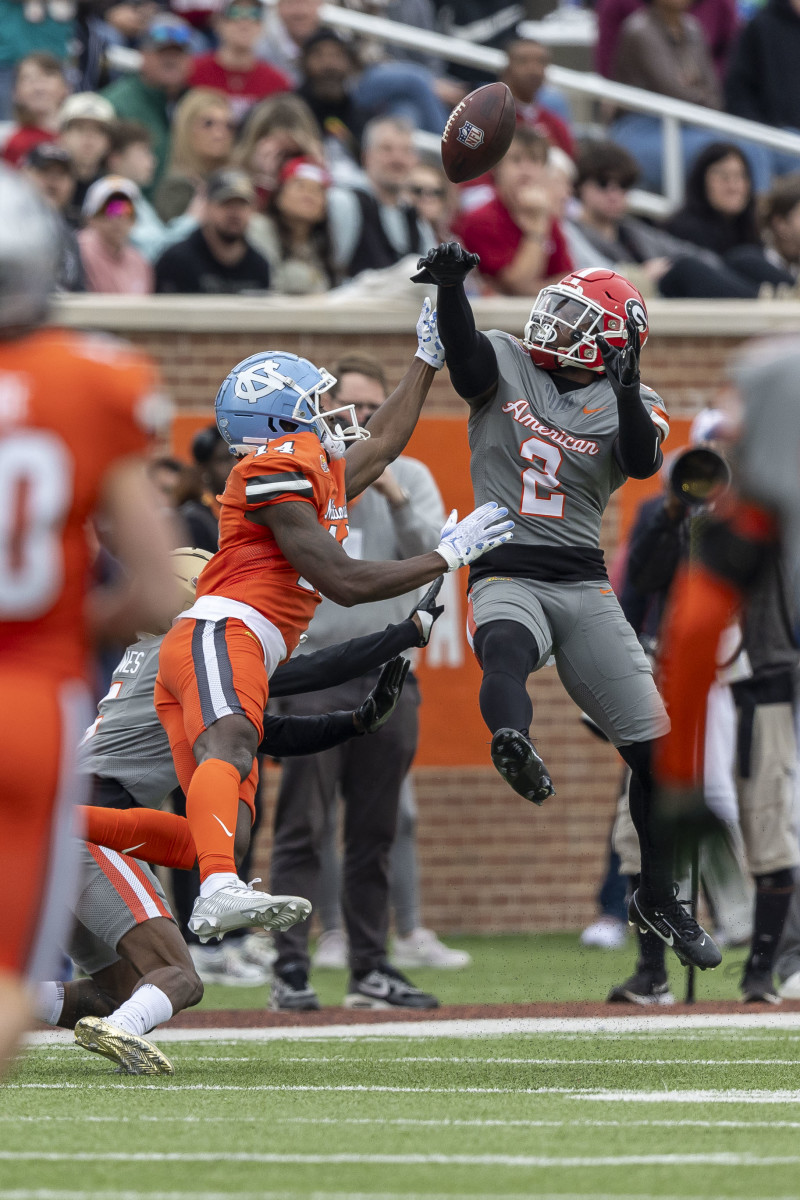 Feb 3, 2024; Mobile, AL, USA; American defensive back Tykee Smith of Georgia (5) deflects a pass from National wide receiver Devontez Walker of North Carolina (14) during the first half of the 2024 Senior Bowl football game at Hancock Whitney Stadium. Mandatory Credit: Vasha Hunt-USA TODAY Sports