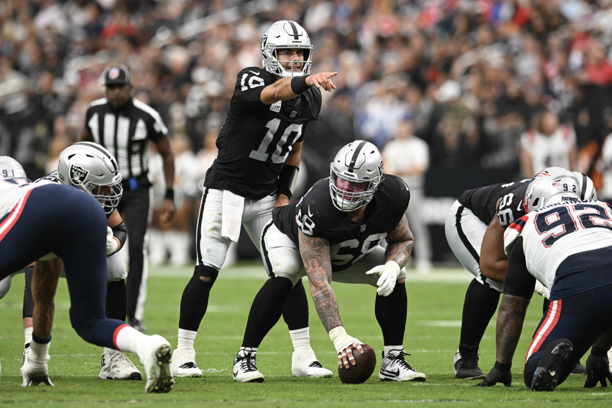 Oct 15, 2023; Paradise, Nevada, USA; Las Vegas Raiders quarterback Jimmy Garoppolo (10) lines up behind centre Andre James (68) in the first quarter at Allegiant Stadium.