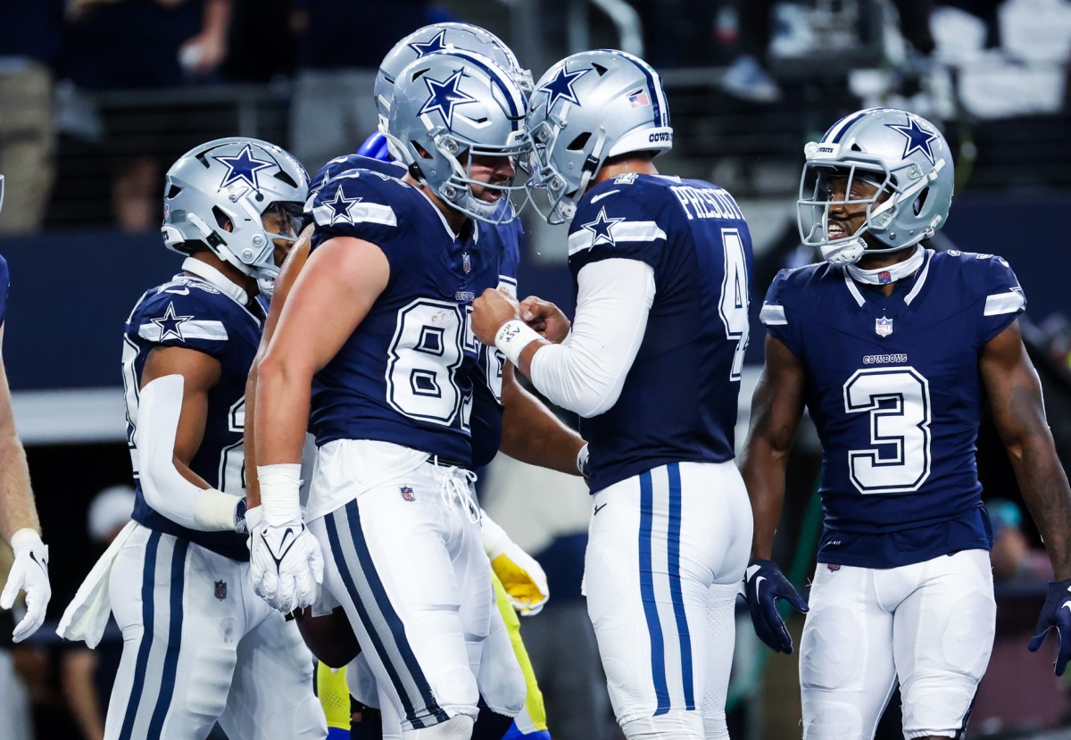 Oct 29, 2023; Arlington, Texas, USA; Dallas Cowboys tight end Jake Ferguson (87) celebrates with Dallas Cowboys quarterback Dak Prescott (4) after catching a touchdown pass during the first quarter against the Los Angeles Rams at AT&T Stadium.