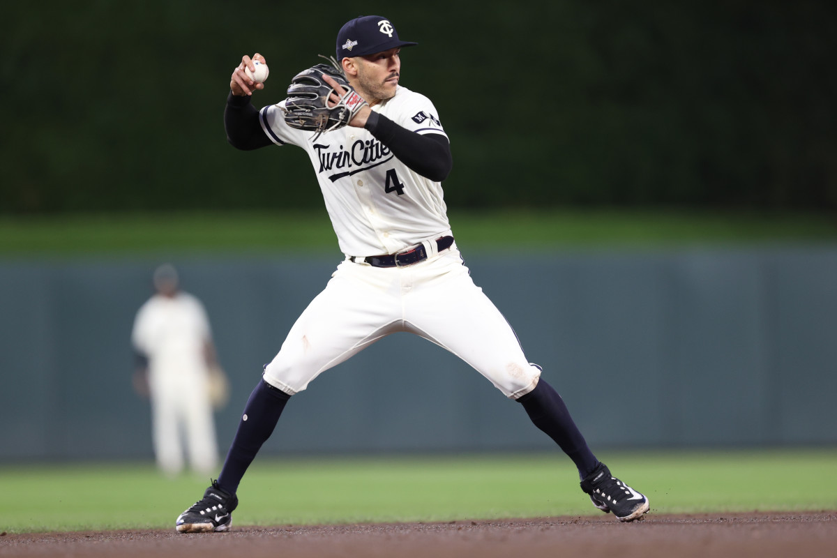 Oct 11, 2023; Minneapolis, Minnesota, USA; Minnesota Twins shortstop Carlos Correa (4) fields a ground ball in the third inning against the Houston Astros during game four of the ALDS for the 2023 MLB playoffs at Target Field.