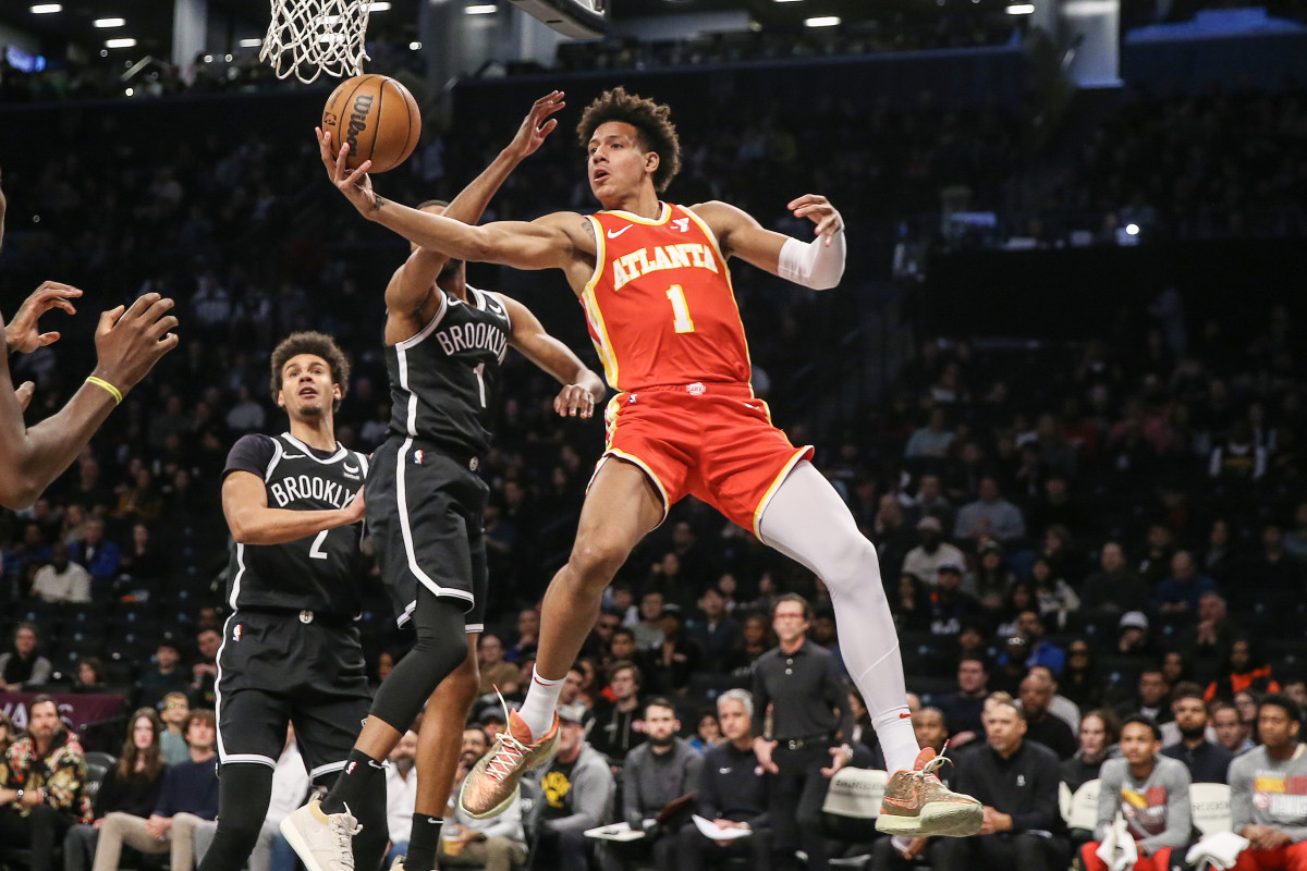 Mar 2, 2024; Brooklyn, New York, USA; Atlanta Hawks forward Jalen Johnson (1) drives past Brooklyn Nets forward Mikal Bridges (1) in the first quarter at Barclays Center. Mandatory Credit: Wendell Cruz-USA TODAY Sports
