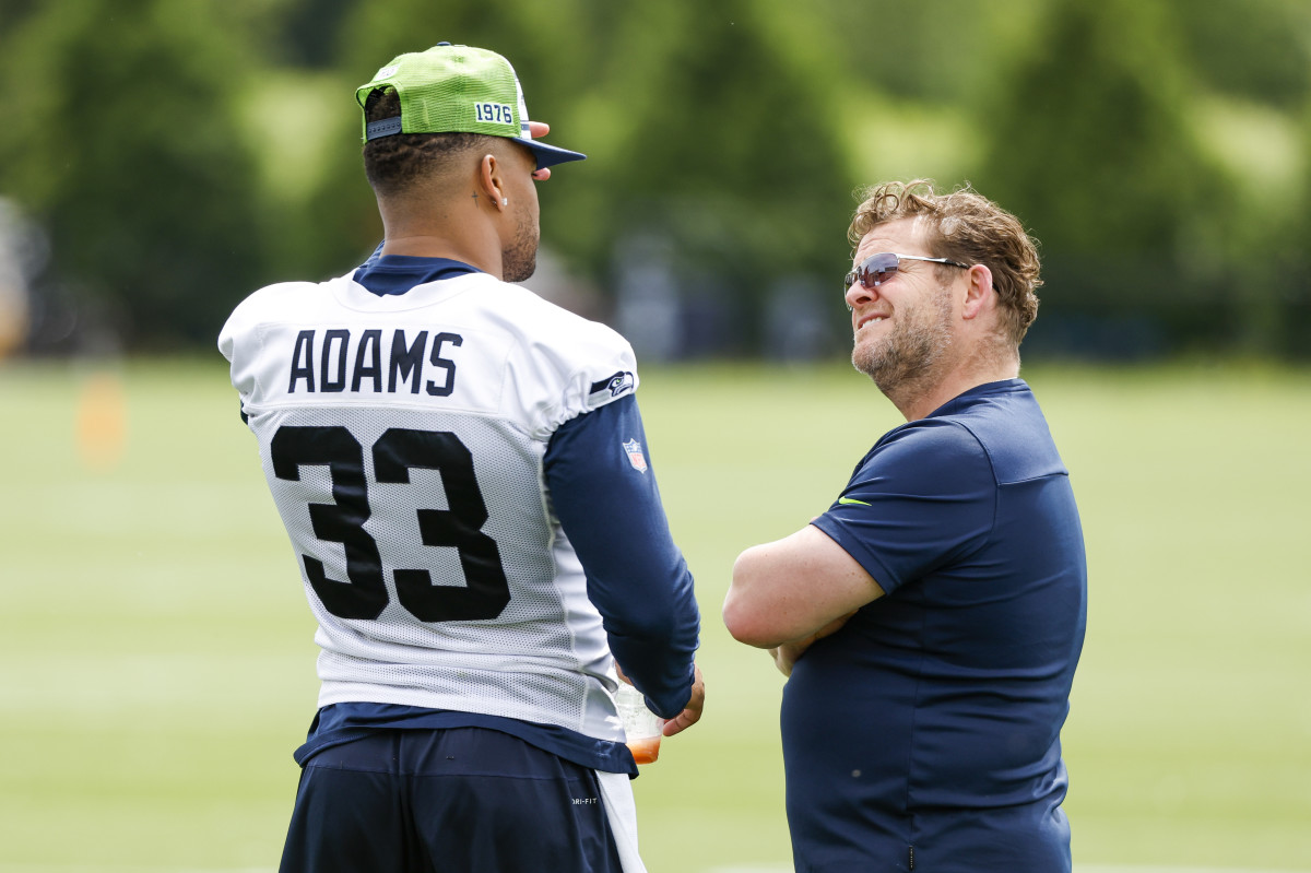 Seattle Seahawks strong safety Jamal Adams (33) talks with general manager John Schneider during minicamp practice at the Virginia Mason Athletic Center Field.