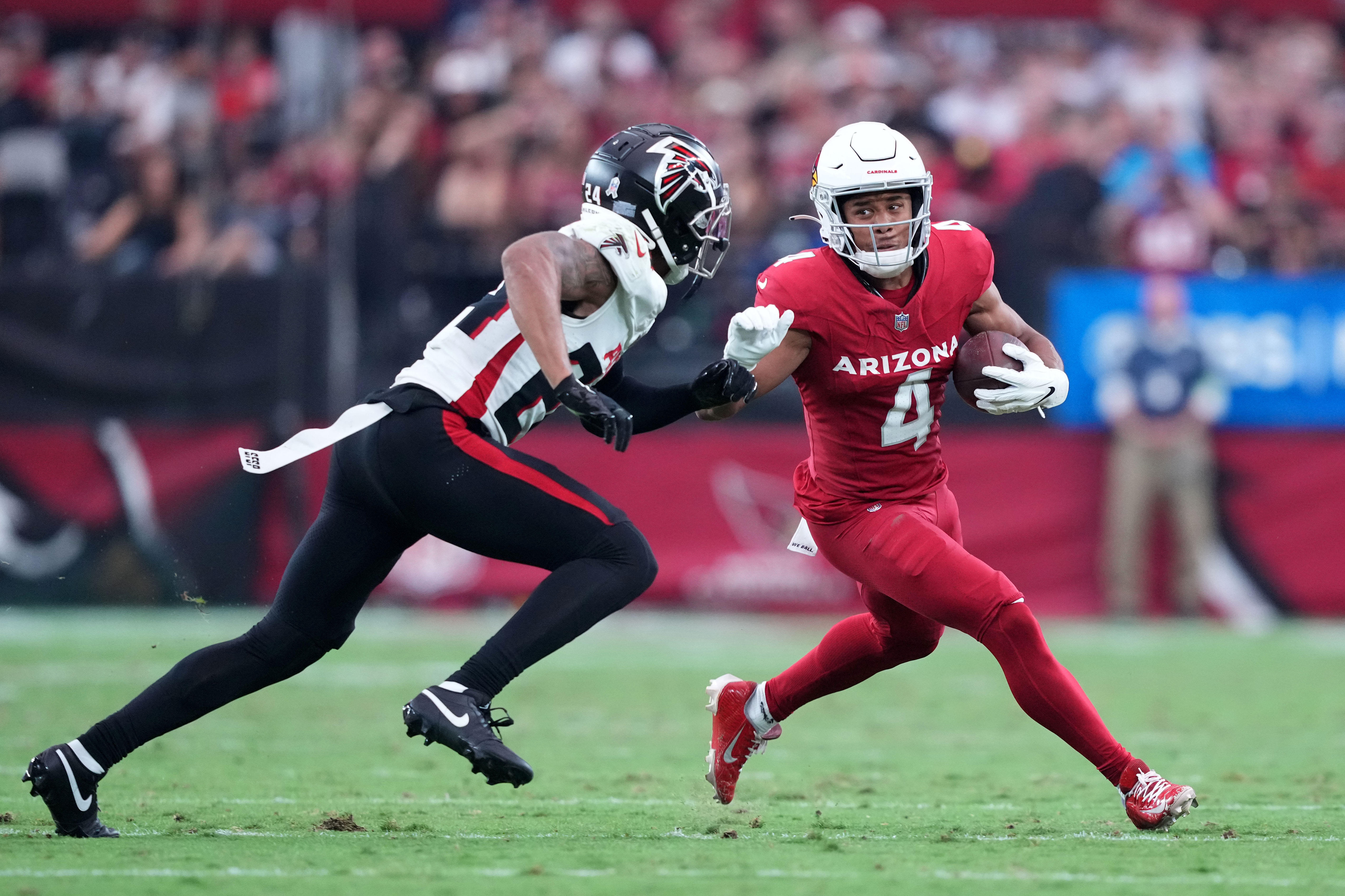 Nov 12, 2023; Glendale, Arizona, USA; Arizona Cardinals wide receiver Rondale Moore (4) runs against Atlanta Falcons cornerback A.J. Terrell (24) during the first half at State Farm Stadium.