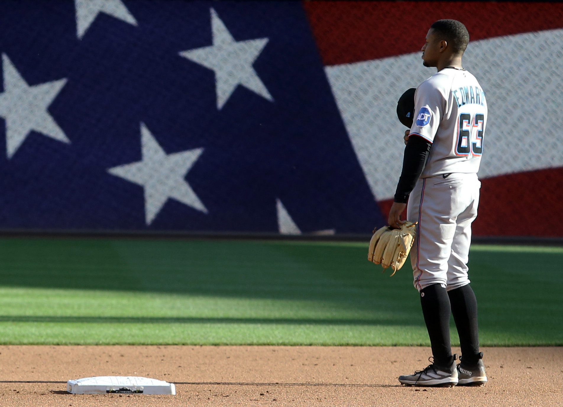 Oct 1, 2023; Pittsburgh, Pennsylvania, USA; Miami Marlins second baseman Xavier Edwards (63) stands for the playing of God Bless America against the Pittsburgh Pirates during the seventh inning at PNC Park. Mandatory Credit: Charles LeClaire-USA TODAY Sports  