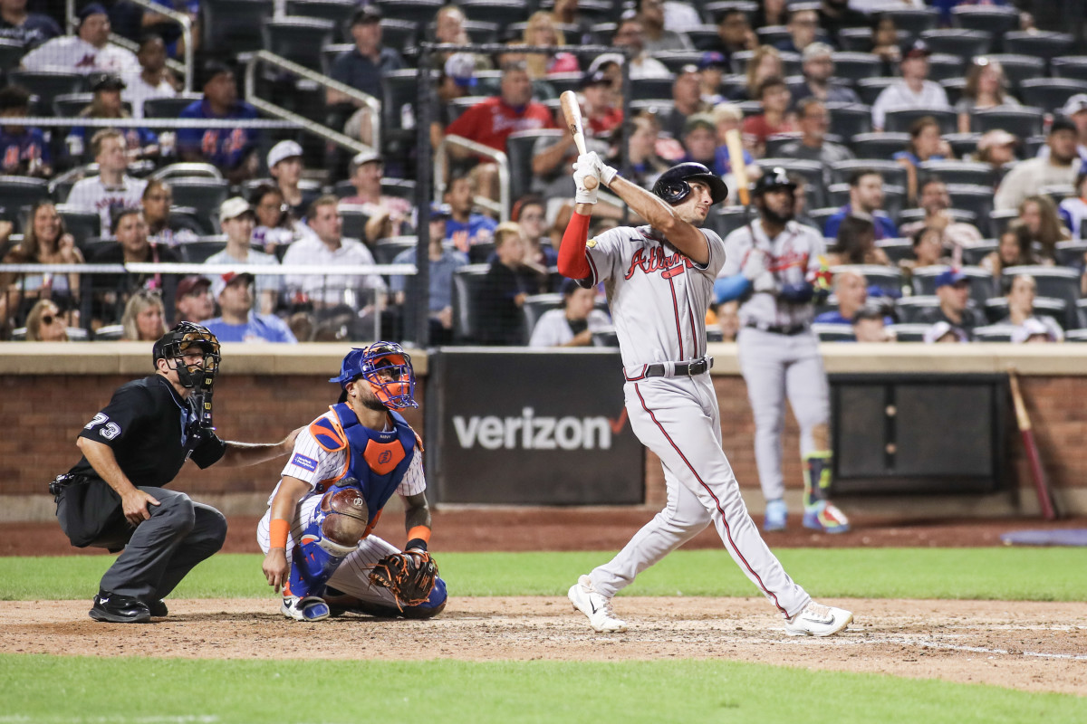 Aug 13, 2023; New York City, New York, USA; Atlanta Braves first baseman Matt Olson (28) hits a two run home run in the eighth inning against the New York Mets at Citi Field.
