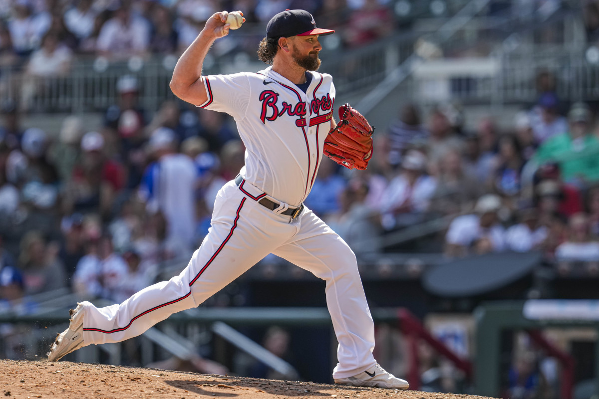 Aug 20, 2023; Cumberland, Georgia, USA; Atlanta Braves relief pitcher Kirby Yates (22) pitches against the San Francisco Giants during the ninth inning at Truist Park.