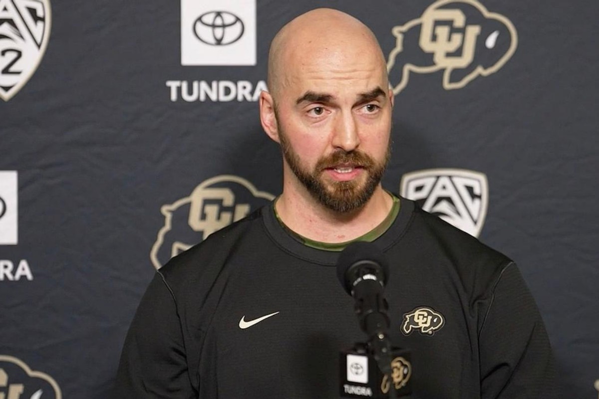 Sean Lewis at the podium at CU