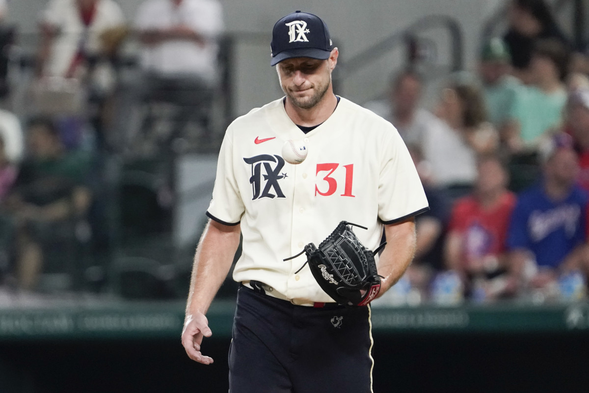 Sep 1, 2023; Arlington, Texas, USA; Texas Rangers starting pitcher Max Scherzer (31) reacts after giving up a single during the fourth inning against the Minnesota Twins at Globe Life Field. Mandatory Credit: Raymond Carlin III-USA TODAY Sports