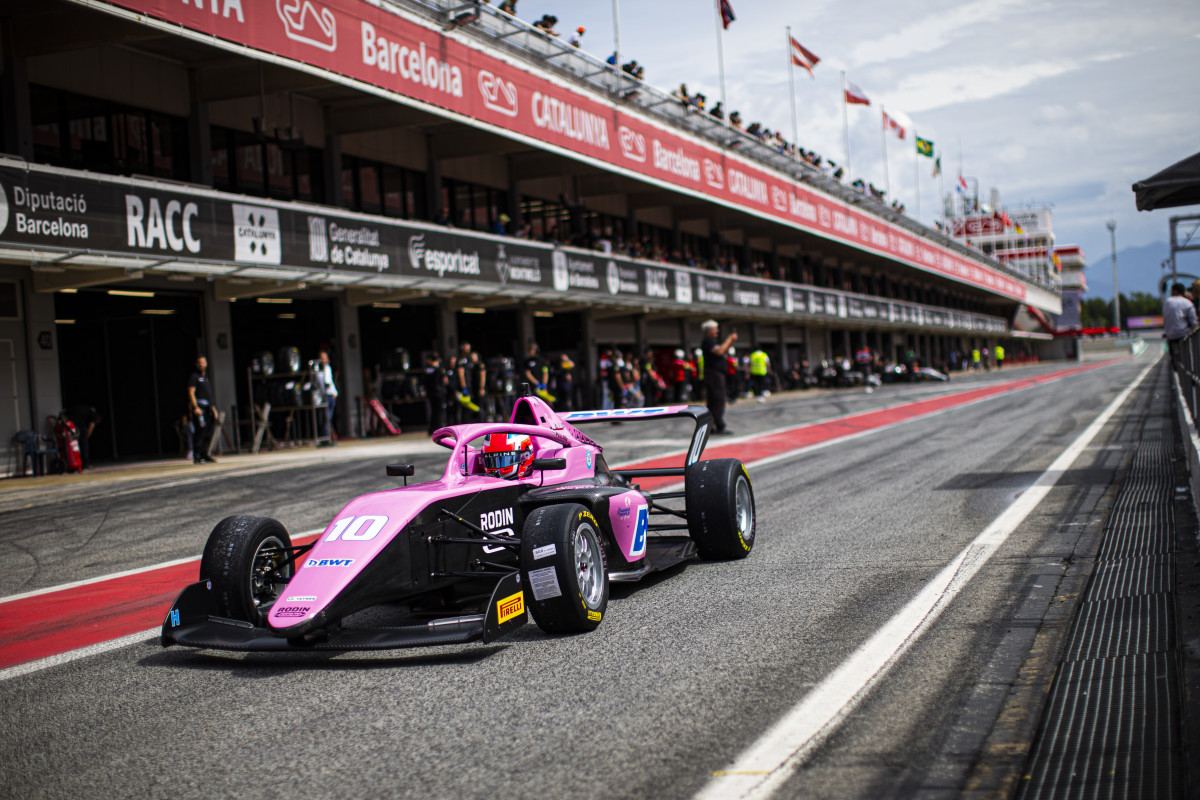 Abbi Pulling drives in a pink racecar