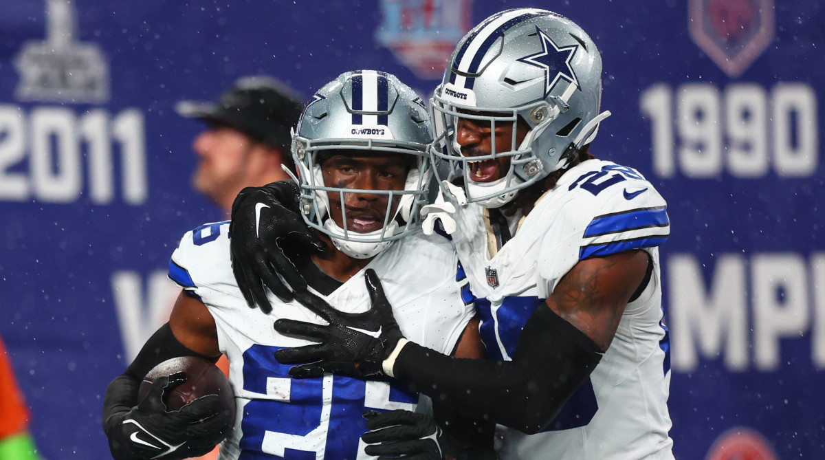 Cowboys cornerback DaRon Bland (left) celebrates his touchdown against the Giants in Week 1