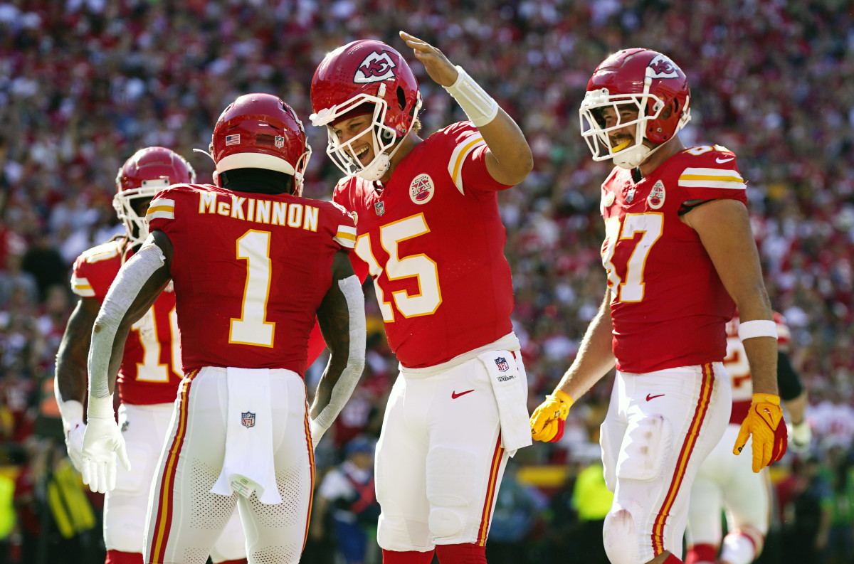 Sep 24, 2023; Kansas City, Missouri, USA; Kansas City Chiefs running back Jerick McKinnon (1) celebrates with quarterback Patrick Mahomes (15) and tight end Travis Kelce (87) after scoring a touchdown against the Chicago Bears during the first half at GEHA Field at Arrowhead Stadium. Mandatory Credit: Jay Biggerstaff-USA TODAY Sports  
