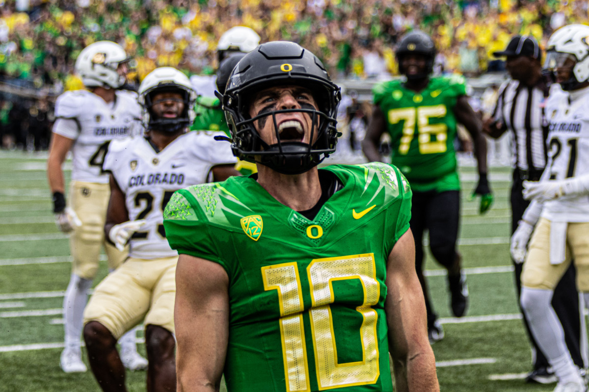 Quarterback Bo Nix celebrates a touchdown run against the Colorado Buffaloes.