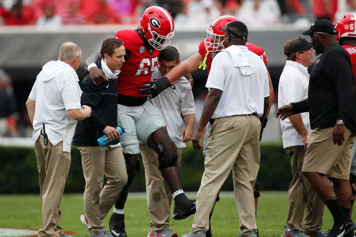 Amarius Mims is carried off against South Carolina in week 3 of the 2023 season / Photo - Joshua Jones 