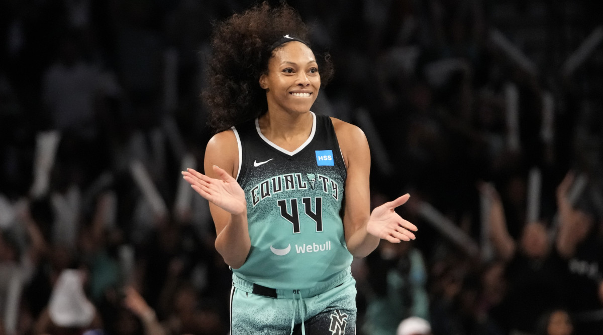 New York Liberty forward Betnijah Laney smiles after hitting a 3-pointer against the Connecticut Sun during the WNBA playoffs.