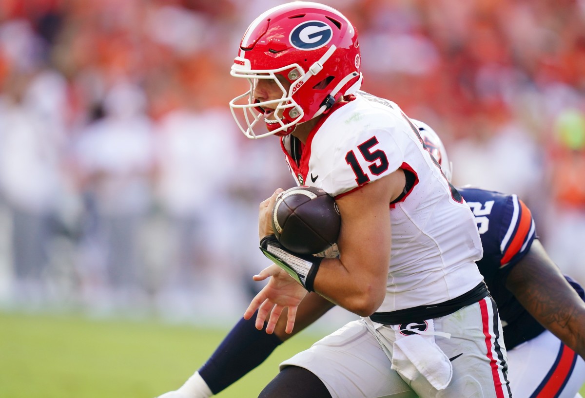 Sep 30, 2023; Auburn, Alabama, USA; Georgia Bulldogs quarterback Carson Beck scrambles for yardage against the Auburn Tigers during the third quarter at Jordan-Hare Stadium. Mandatory Credit: John David Mercer-USA TODAY Sports