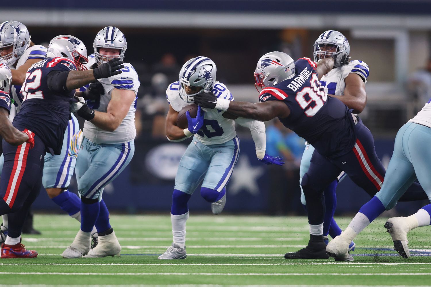 Dallas Cowboys running back Tony Pollard (20) runs the ball during their game against the New England Patriots at AT&T Stadium Sunday. The Cowboys won 38-3.