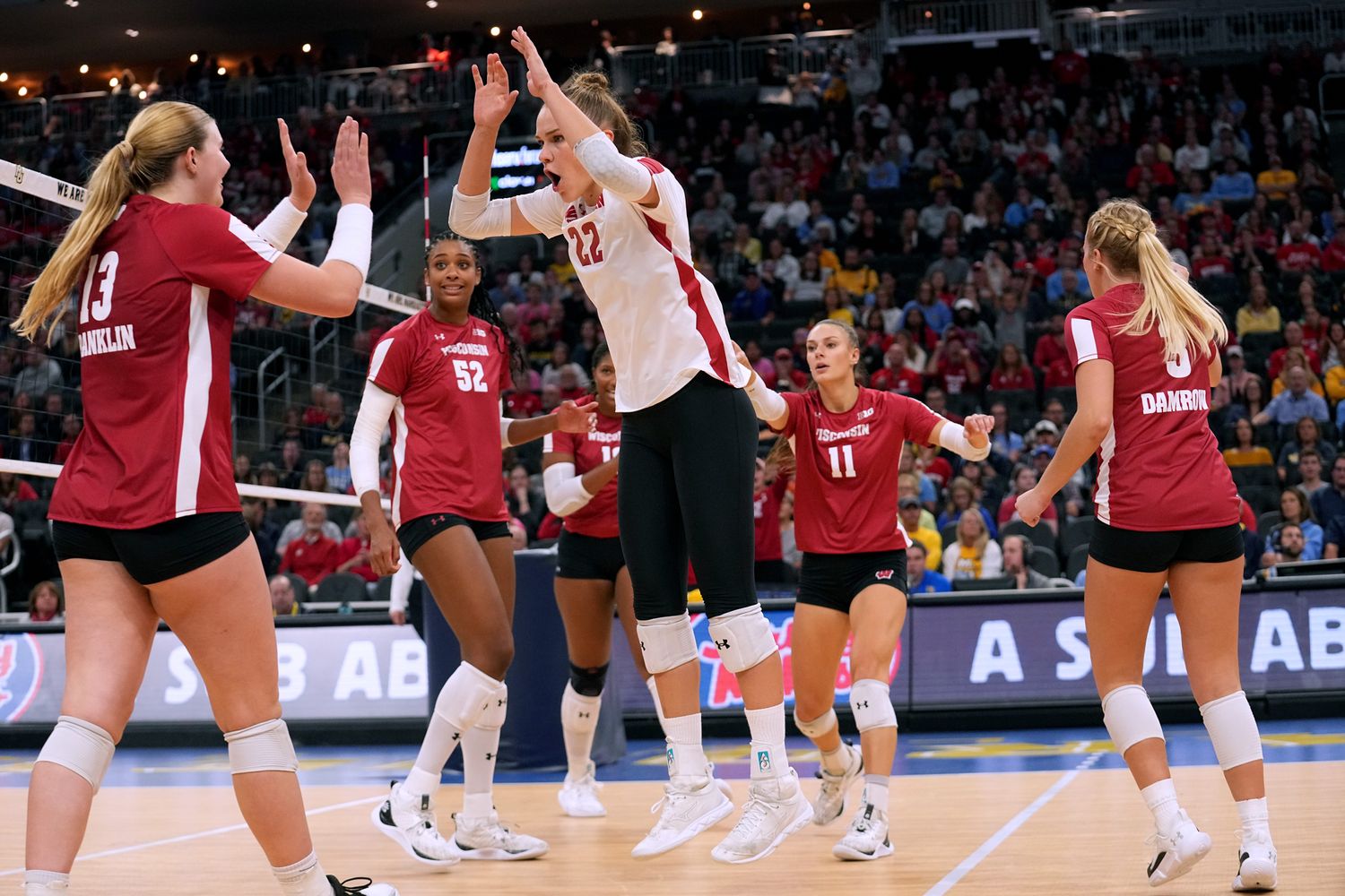 Wisconsin outside hitter Julia Orzol (22) and outside hitter Sarah Franklin (13) celebrate their win over Marquette after their volleyball match Wednesday, September 13, 2023 at Fiserv Forum in Milwaukee, Wis. Official attendance was 17,037 making it the largest indoor regular-season crowd for a volleyball match in NCAA history and the largest crowd to see a women s sporting event in Wisconsin history.