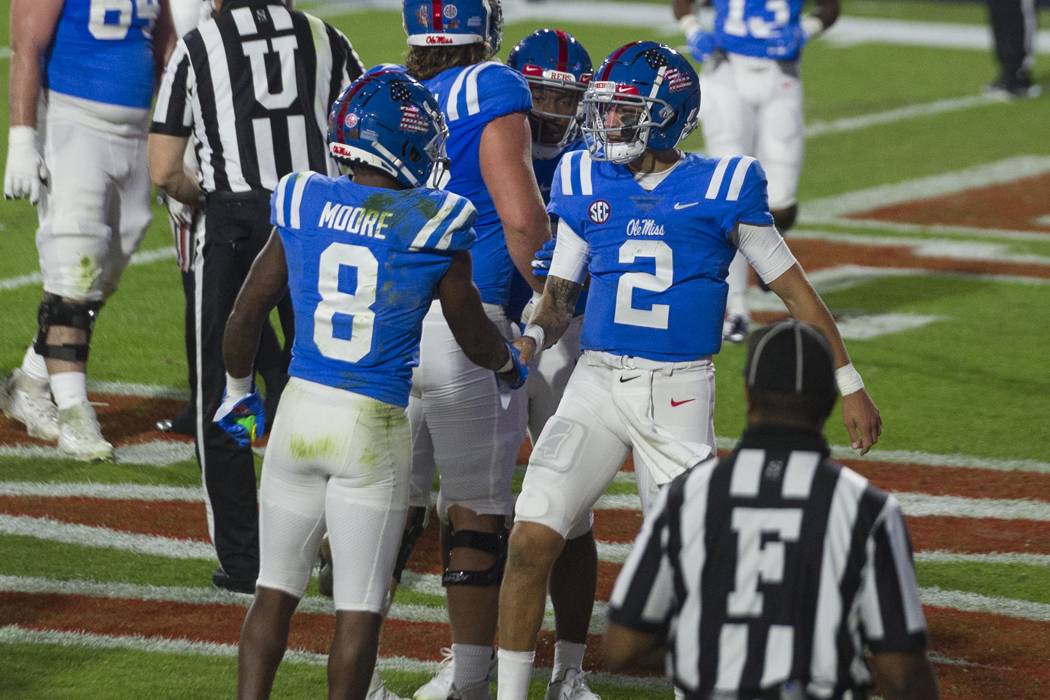 Nov 14, 2020; Oxford, Mississippi, USA; Mississippi Rebels quarterback Matt Corral (2) and wide receiver Elijah Moore (8) celebrate during the first half against the South Carolina Gamecocks at Vaught-Hemingway Stadium. Mandatory Credit: Justin Ford-USA TODAY Sports