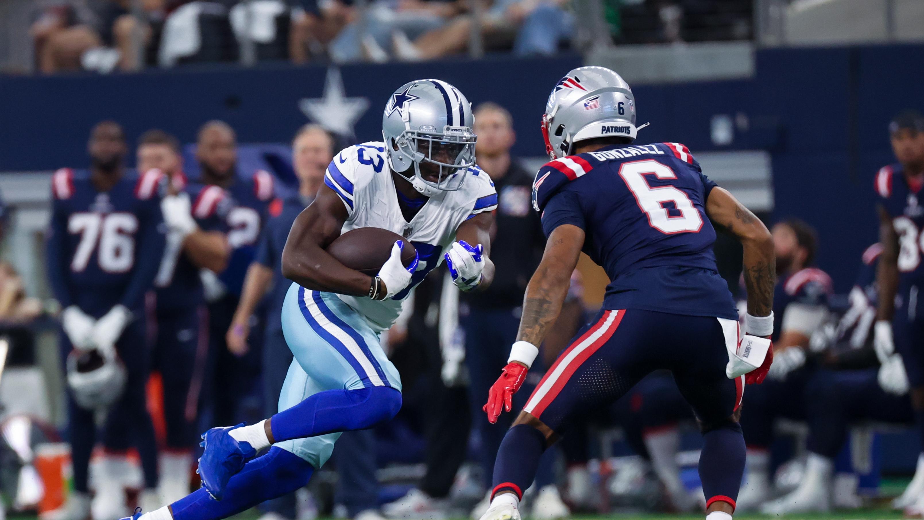 Oct 1, 2023; Arlington, Texas, USA; Dallas Cowboys wide receiver Michael Gallup (13) runs with the ball as New England Patriots cornerback Christian Gonzalez (6) defends during the first quarter at AT&T Stadium.