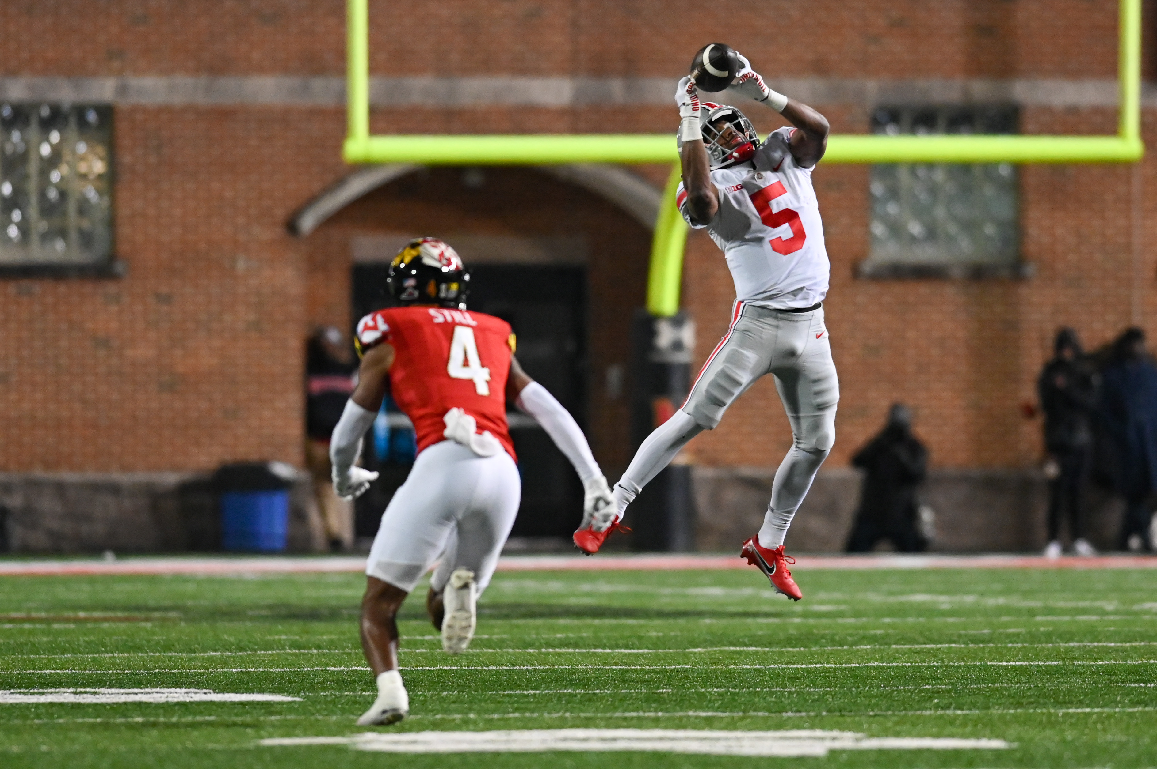 Ohio State receiver Garrett Wilson (No. 5) makes a third-down catch against Maryland defensive back Corey Still (No. 4). 