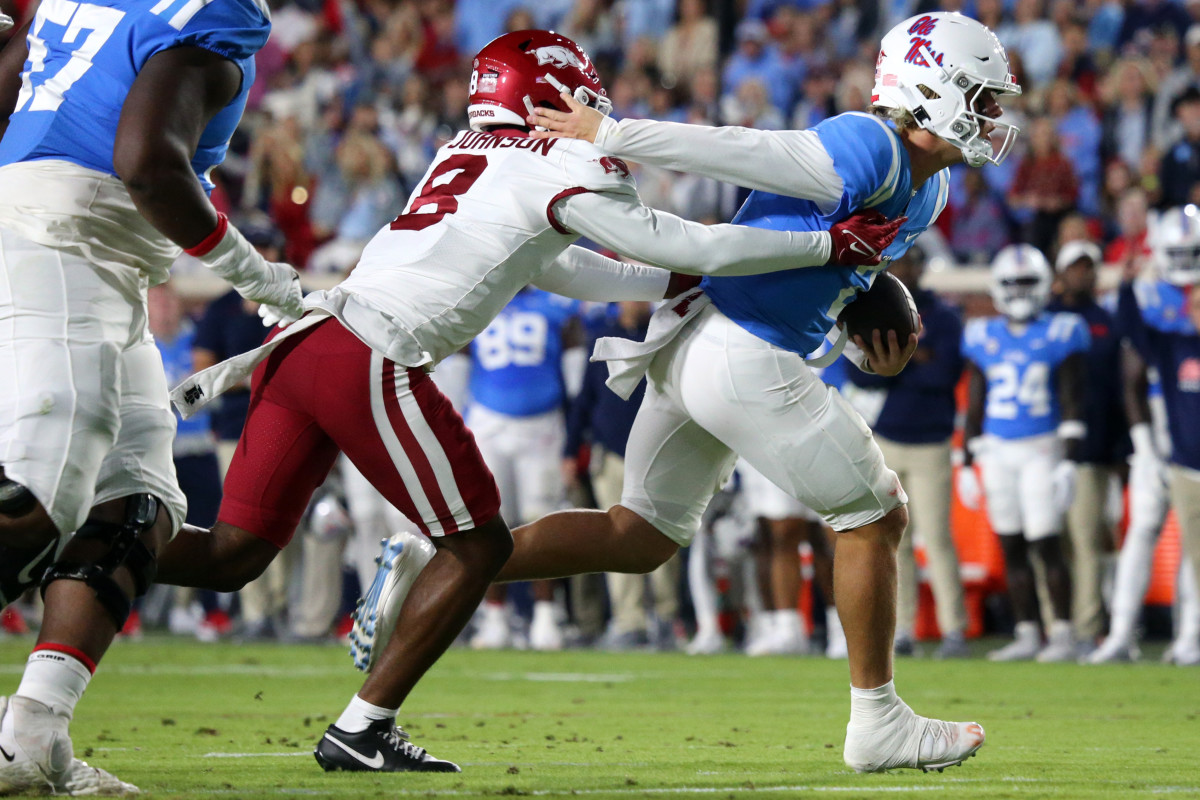 Ole Miss QB Jaxson Dart attempts to escape a sack against the Arkansas Razorbacks on Oct. 7.